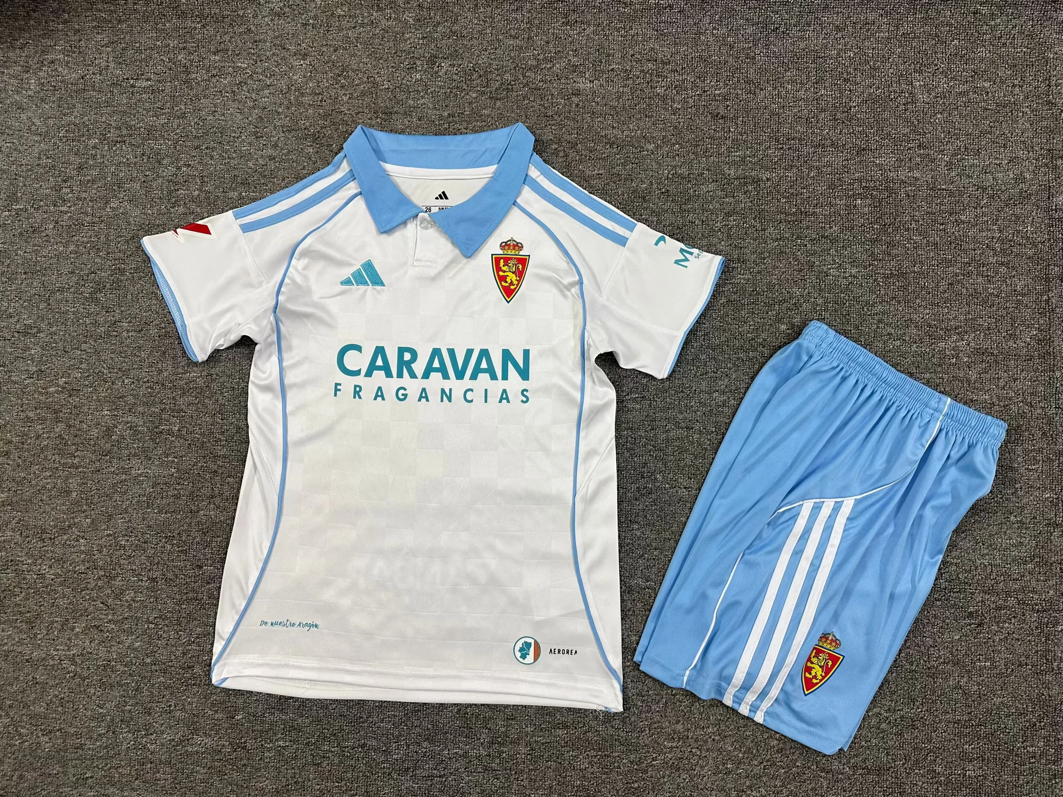 75d20f6a28c34516b23622ef8ac5c8f6.webp 2025/2026 Real Zaragoza Home Football Shirt Kids Size 1:1 Thai Quality - Image 1